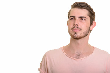 Fototapeta premium Portrait of young handsome bearded man thinking