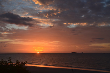 Orange cloudy tropical sunrise seascape, Thailand.