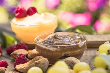 Almond Butter and Marzipan butter on a Wooden natural Table with Raw nuts