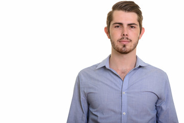 Fototapeta premium Portrait of young handsome bearded businessman looking at camera