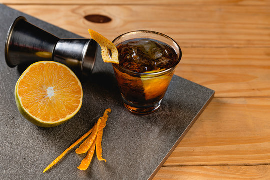 Rabo de Galo Cocktails on stone background in gray color. Brazilian Drink.