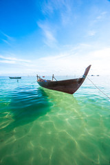 Fototapeta na wymiar beautiful beach and old boats, Bintan Island, Indonesia