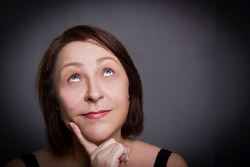 Woman grimaces in front of camera