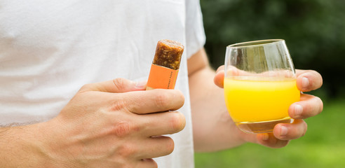  man eating energetic cereals bar annoyed and frustrated shouting with anger, crazy and yelling with raised hand, anger concept