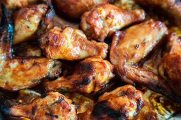Close up image Grilled chicken wings and legs on  table, Top view.