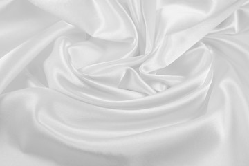 Obraz premium The texture of the satin fabric of white color for the background