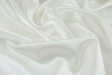 Fototapeta premium The texture of the satin fabric of white color for the background