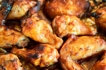 Close up image Grilled chicken wings and legs on  table, Top view.