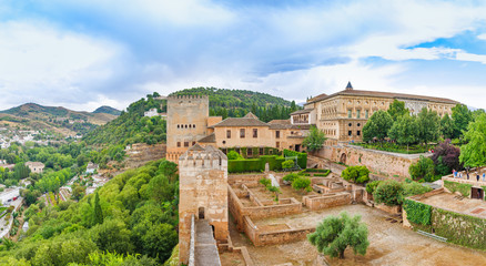 Alhambra. Panoramic view on alcazaba, palaces, mountains and old city. UNESCO heritage site. Granada, Andalusia, Spain