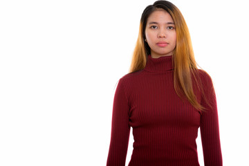 Studio shot of young Asian woman with turtleneck sweater