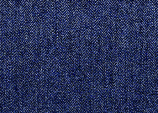 Venerable Blue, grey Herringbone tweed, Wool Background Texture. Coat close-up. Expensive men's suit fabric. Virgin wool extra-fine. High resolution