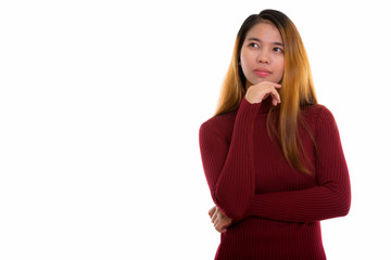 Studio shot of young Asian woman with turtleneck sweater