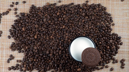  mug of milk with cookies on a background of coffee battles flatlay