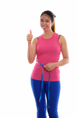 Studio shot of young Asian woman ready for gym