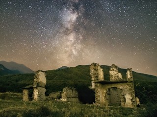 Milky way over an abandoned house