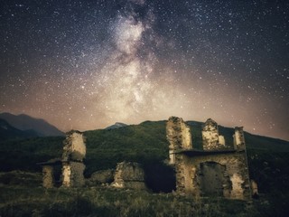 Milky way over an abandoned house