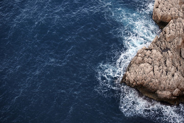 Sea surf at the coastal rocks