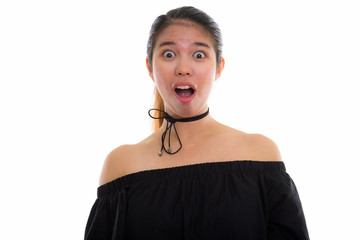 Studio shot of young Asian woman against white background