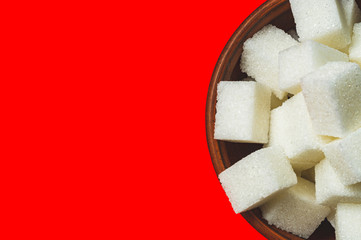 half clay Cup with refined sugar on red background, mock up, space for text on the left