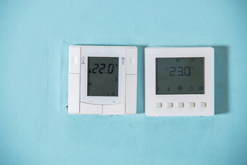 A Honeywell programmable thermostat to control the air conditioner and heater in a home. air...