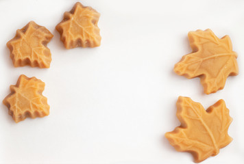 Maple syrup sweets on a white background