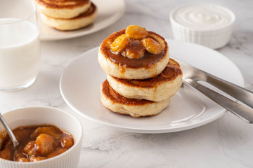 Closeup of a stack of banana homemade pancakes. Copy space.