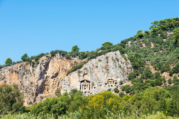 Fototapeta na wymiar Beautiful view of ancient Lycian rock tombs on a sunny day. Dalyan. Turkey.