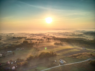 Early Morning Fog Sweeps Across Majestic Landscape © Marcin