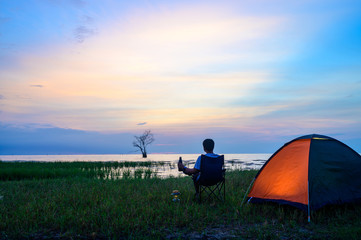 Tent and chairs by the lake