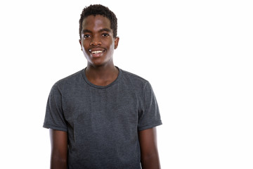 Studio shot of young African teenage boy with Afro hair