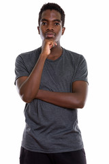 Studio shot of young African teenage boy with Afro hair