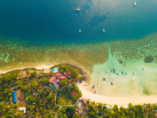 Aerial view of Phi Phi, Maya beach with blue turquoise seawater, mountain hills, and tropical green...