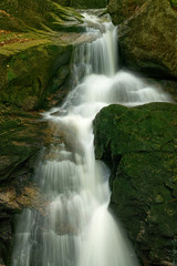 Fototapeta na wymiar Maly Falls in super green forest surroundings, Czech Republic