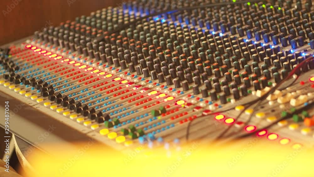Poster professional audio mixing console, mixer. pro audio mixing board faders and knobs. static shot of mu