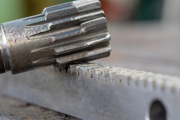 Macro of  gear drive shaft and rack with broken teeth
