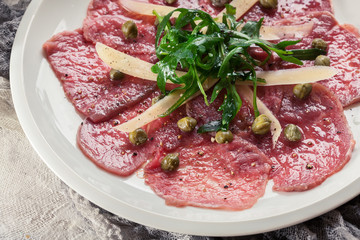 Beef carpaccio with arugula and parmesan