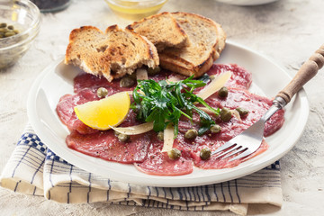 Beef carpaccio with arugula and parmesan