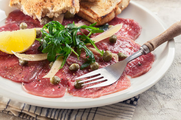 Beef carpaccio with arugula and parmesan