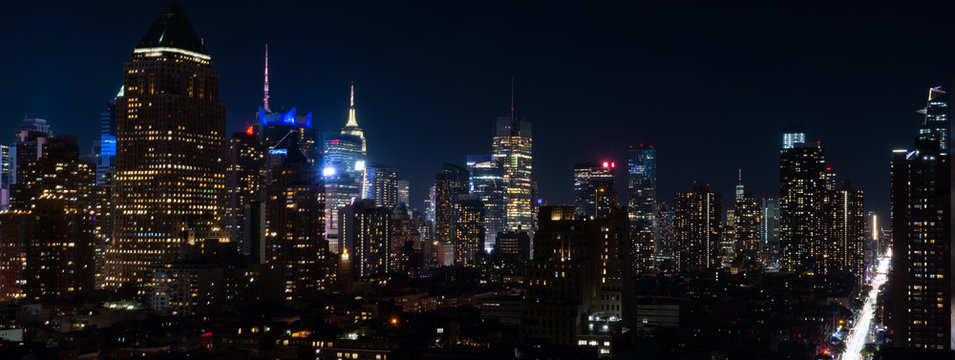 Panoramic night view of Midtown Manhattan and Hell's Kitchen