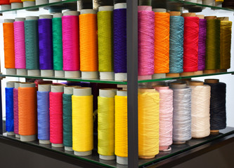 Fototapeta na wymiar Group of Large multicolored polypropylene threads set. Colored bobbin thread. Polypropylene multifilament yarns. Set of sewing thread coils, miscellaneous colours.