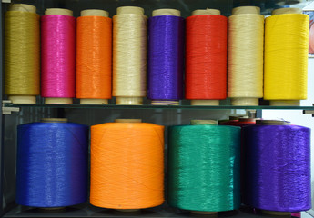 Large colorful polypropylene threads set. Multicolored bobbin thread. Polypropylene multifilament yarns. Set of sewing thread coils, miscellaneous colours.