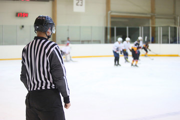 Referee looks on during ice hockey game