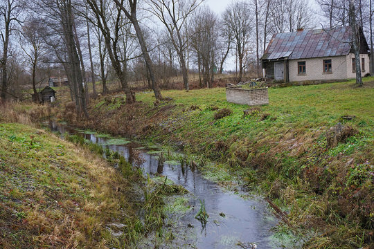 creek in the village with house on coast