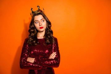 Portrait of arrogant girl having golden crown feel egocentric look copy space cross her hands wear...