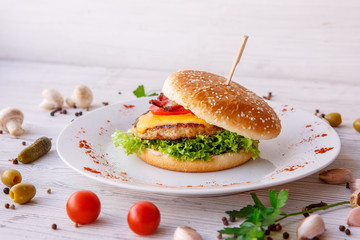 Burger on wooden light background, fast food, street food
