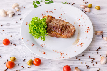 steak on a white plate