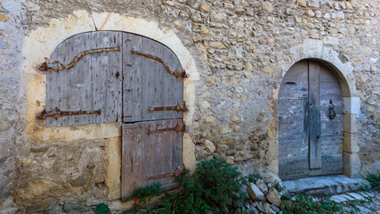 Fototapeta na wymiar medieval arched doors and windows in a village in Provence