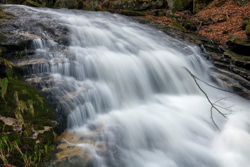 Obraz premium Jeleni Falls in super green forest surroundings, Czech Republic