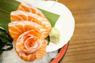 Sliced salmon sashimi served on platter, Japanese food delicious menu
