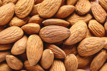Many tasty almonds as background